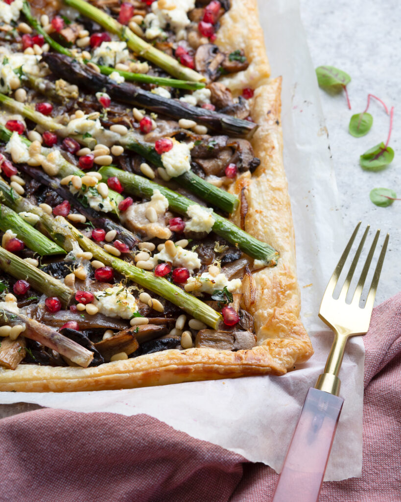 Plantbased Christmas recipe Asparagus tart with pomegranate Photography by Nelly le Comte